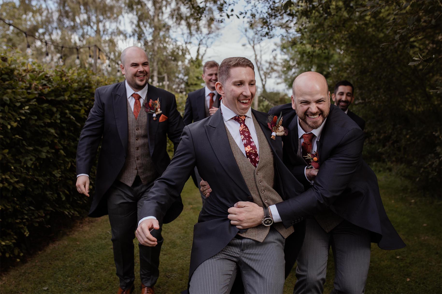 fun wedding photography groomsmen and groom