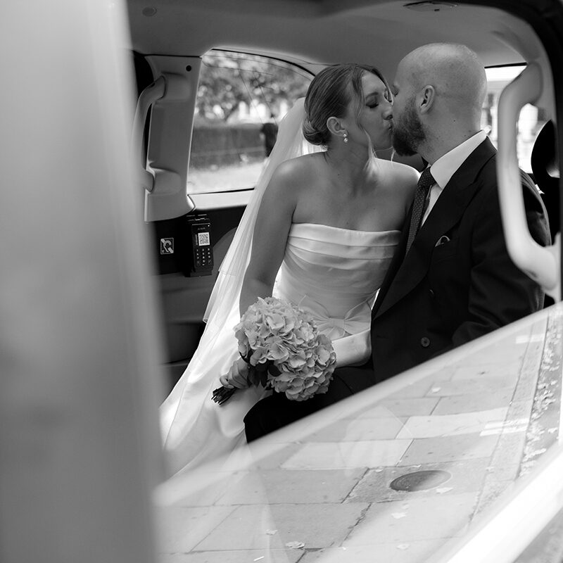 editorial London wedding taxi kiss