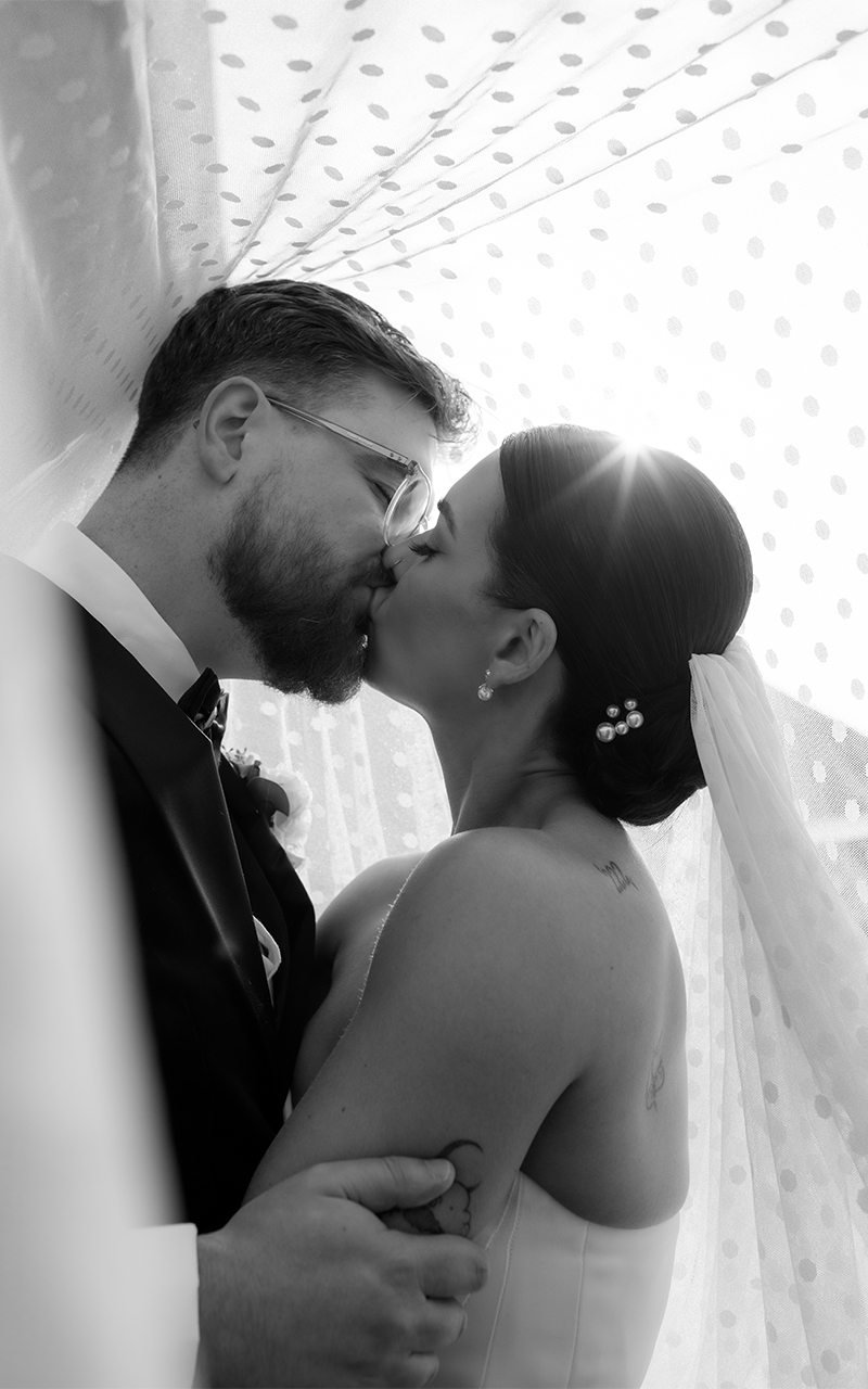 old gore wedding under veil kiss